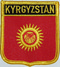 Aufnher Flagge Kirgisistan (1992-2023)
 in Wappenform (6,2 x 7,3 cm) Flagge Flaggen Fahne Fahnen kaufen bestellen Shop