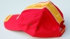 Lauf-Cap Spanien rot: Bikercap-Spanien-rot-gelb-von-der-Seite 