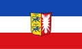 Bild der Flagge "Flagge Schleswig-Holstein mit Wappen im Querformat (Glanzpolyester)"